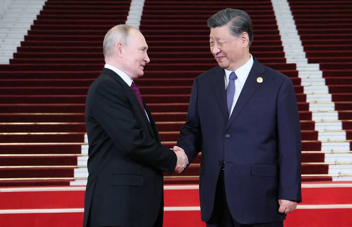 Vladimir Putin y Xi Jinping, el 17 de octubre, durante la ceremonia de bienvenida en el Tercer Foro de la Franja y la Ruta en Beijing. · Foto: Sergei Savostyanov, pool, AFP