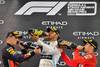 Max Verstappen (tercero en el podio), Lewis Hamilton, ganador de la carrera, y Charles Leclerc (segundo), celebran en el circuito Yas Marina, en Abu Dabi, luego del final del Gran Premio de Fórmula 1. · Foto: Giuseppe Cacace Max Verstappen (tercero en el podio), Lewis Hamilton, ganador de la carrera, y Charles Leclerc (segundo), celebran en el circuito Yas Marina, en Abu Dabi, luego del final del Gran Premio de Fórmula 1. · Foto: Giuseppe Cacace