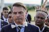El presidente brasileño, Jair Bolsonaro, durante una ceremonia de izado de la bandera nacional con indígenas brasileños. · Foto: Sergio Lima, AFP El presidente brasileño, Jair Bolsonaro, durante una ceremonia de izado de la bandera nacional con indígenas brasileños. · Foto: Sergio Lima, AFP