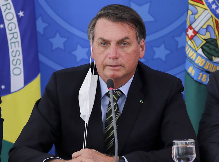 Jair Bolsonaro, durante una conferencia de prensa, el 18 de marzo, en el Palacio de Planalto, Brasilia. · Foto: Sergio Lima, AFP