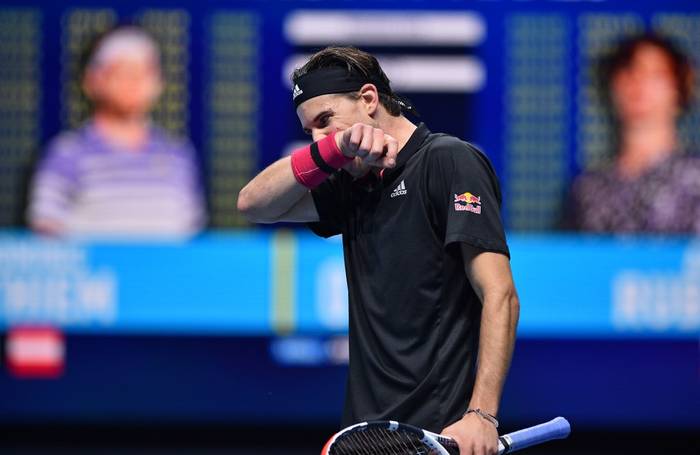 El austriaco Dominic Thiem reacciona durante el partido contra el ruso Andrey Rublev en su partido de ida y vuelta en la quinta jornada del torneo de tenis ATP World Tour Finals. · Foto: Glyn Kirk, AFP