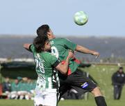 Francisco Ibáñez, de Racing, y Matías Cóccaro, de Rampla Juniors.