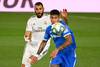 Karim Benzema, de Real Madrid, y Mathías Olivera, de Getafe, este jueves, en el estadio Alfredo di Stéfano, en Valdebebas, en las afueras de Madrid.
· Foto: Gabriel Bouys, AFP Karim Benzema, de Real Madrid, y Mathías Olivera, de Getafe, este jueves, en el estadio Alfredo di Stéfano, en Valdebebas, en las afueras de Madrid.
· Foto: Gabriel Bouys, AFP