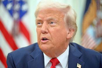 Donald Trump, el 31 de marzo, en la Oficina Oval de la Casa Blanca. · Foto: Saul Loeb, AFP