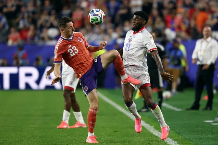 Kenny McLean, de Escocia, y Josue Casimir, de Haití, en el partido por el grupo C, el 13 de junio, en Foxborough. Foto: Franck Fife, AFP