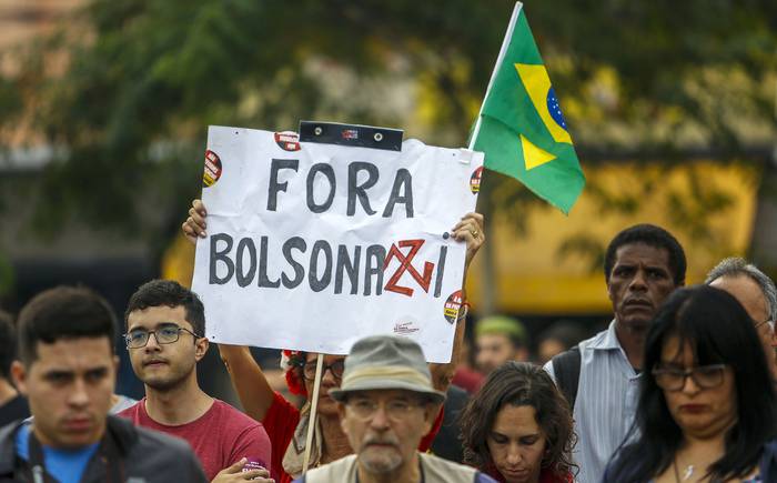 Marcha en contra del Presidente Jair Bolsonaro en San Pablo en mayo. 
 · Foto: Miguel Schincariol/AFP