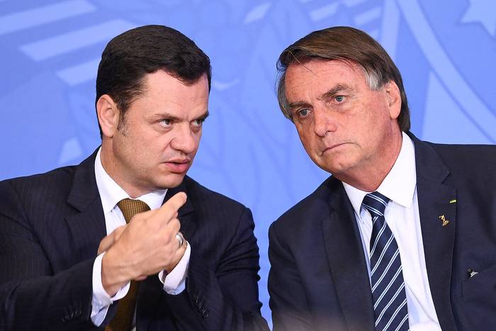 Anderson Torres y Jair Bolsonaro, el 27 de junio de 2022, en el Palacio Planalto en Brasilia. · Foto: Evaristo Sa, AFP