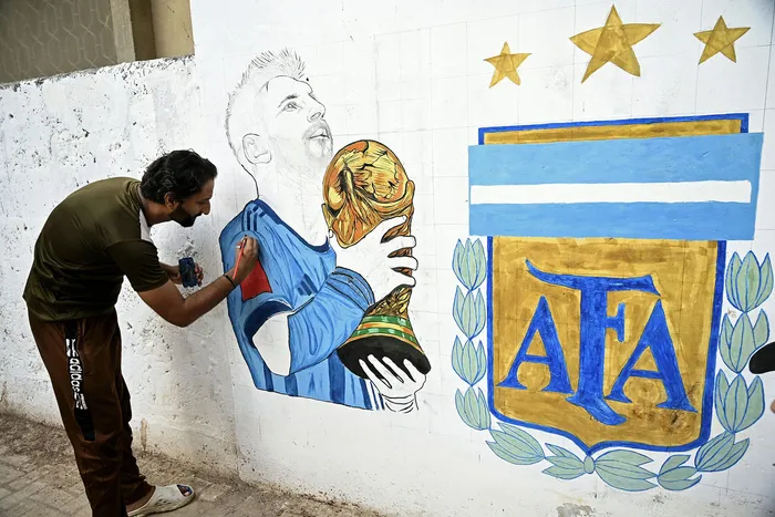 Pintada de mural en Karachi, Pakistán, el 3 de junio. · Foto: Rizwan Tabassum, AFP