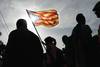 Manifestante con bandera de Estelada catalana, ayer, durante una marcha independentista, en el Día Nacional de Cataluña, la Diada. Manifestante con bandera de Estelada catalana, ayer, durante una marcha independentista, en el Día Nacional de Cataluña, la Diada.