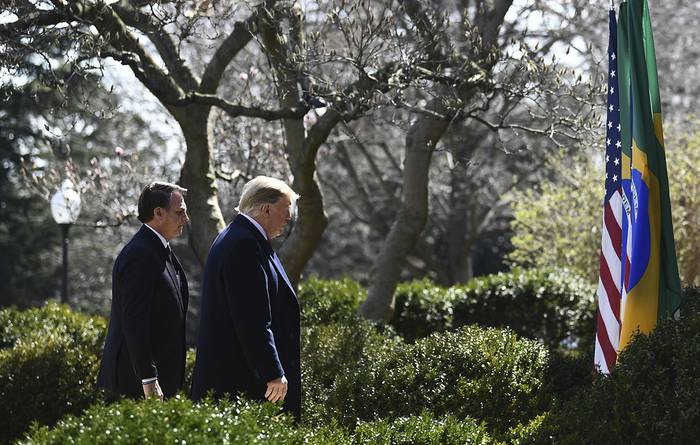 Donald Trump y Jair Bolsonaro, después de una conferencia de prensa en el Jardín de Rosas de la Casa Blanca, en Washington. · Foto: Brendan Smialowski