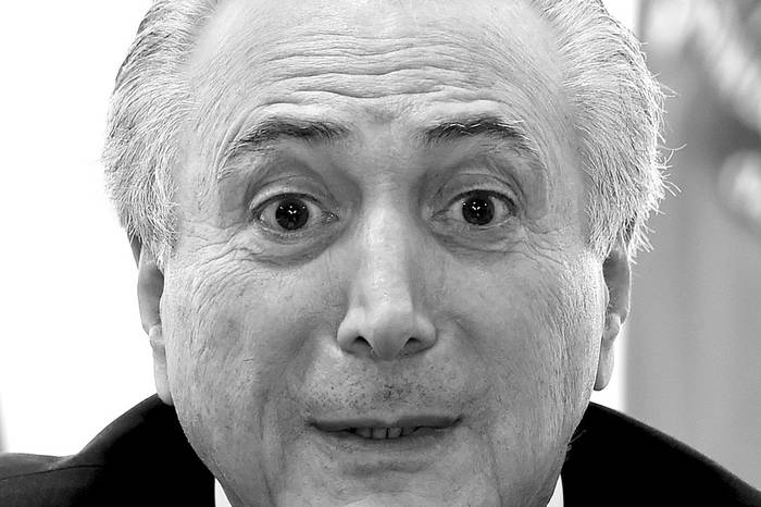 Michel Temer, presidente de Brasil, durante una reunión con los líderes de los partidos aliados en la Cámara Baja, ayer, en el Palacio de Planalto, en Brasilia. Foto: Evaristo Sa, Afp