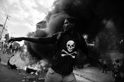 Protestas contra las elecciones presidenciales y para exigir la renuncia del presidente de Haití, Michel Martelly, el sábado, en Puerto Príncipe, Haití. Foto: Héctor Retamal, Afp