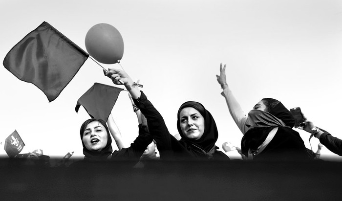 Votantes del presidente iraní y candidato en las próximas elecciones presidenciales, Hasan Rohani, durante un acto de campaña, el 16 de mayo, en el estadio de Takhti, Irán. Foto: Behrouz Mehri, AFP