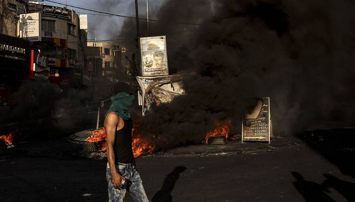 Enfrentamientos con el ejército israelí en la ciudad ocupada de Yenín, en Cisjordania (04.07.2023). · Foto: Ronaldo Schemidt, AFP